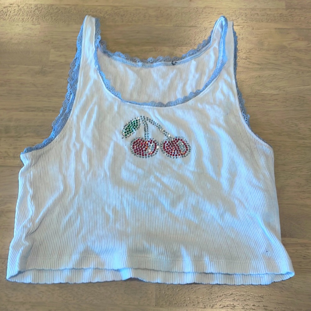 White tank with blue lacing and rhinestone cherry graphic